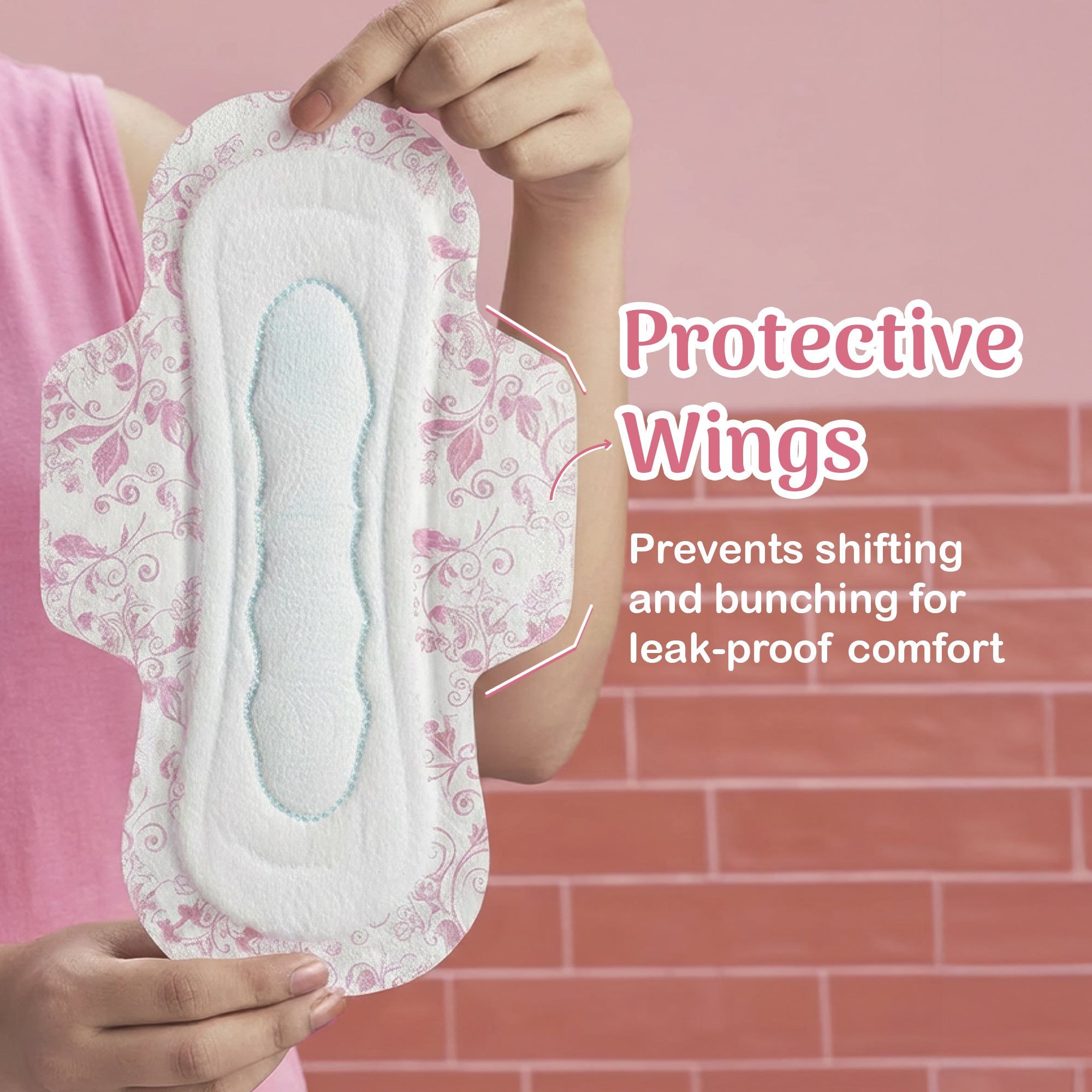 Hand holding a sanitary pad with protective wings against a pink background
