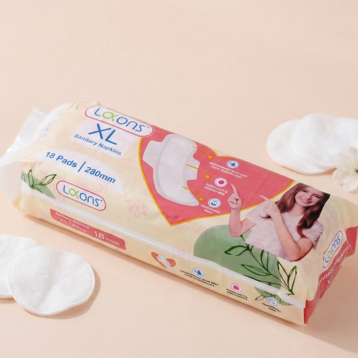 Lakons XL sanitary napkins packaging on a beige background